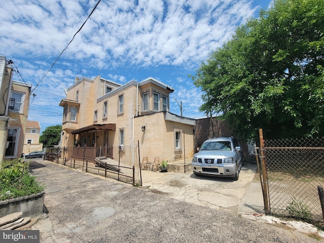 3535 N 8th St, Philadelphia, PA 19140 - view of front of house with stucco siding and fence
