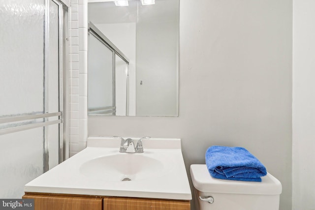 1111 Arlington Blvd Unit 810, Arlington, VA 22209 - bathroom featuring vanity, toilet, and a shower with door