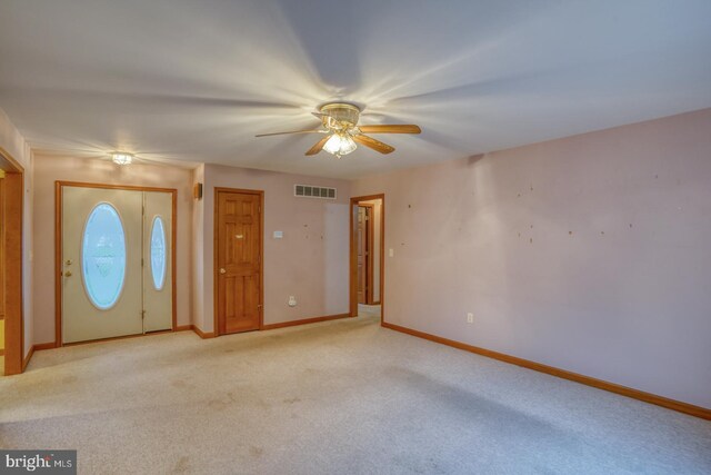 74 Connie Ln, Dover, DE 19901 - foyer entrance featuring ceiling fan, baseboards, and light carpet