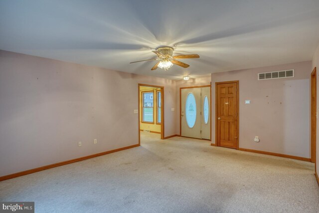 74 Connie Ln, Dover, DE 19901 - entryway with ceiling fan, light colored carpet, and baseboards
