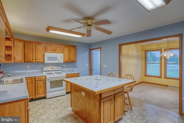 74 Connie Ln, Dover, DE 19901 - kitchen featuring white appliances, a sink, light countertops, and a ceiling fan