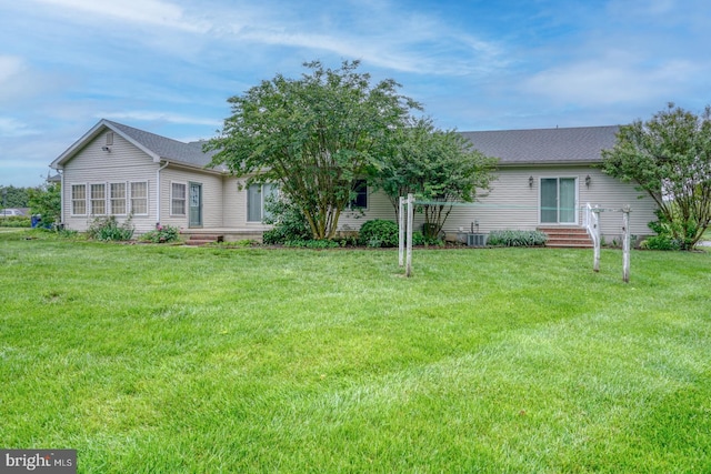 74 Connie Ln, Dover, DE 19901 - rear view of property with a lawn and a shingled roof