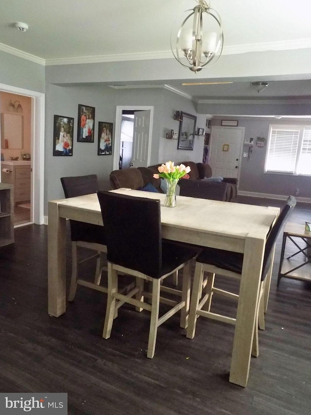 3016 Pennsylvania Ave, Lansdowne, MD 21227 - dining area featuring ornamental molding, a chandelier, wood finished floors, and plenty of natural light
