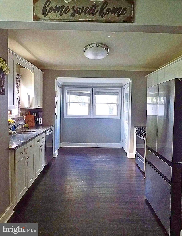 3016 Pennsylvania Ave, Lansdowne, MD 21227 - kitchen with stainless steel appliances, a sink, crown molding, white cabinetry, and dark wood-type flooring