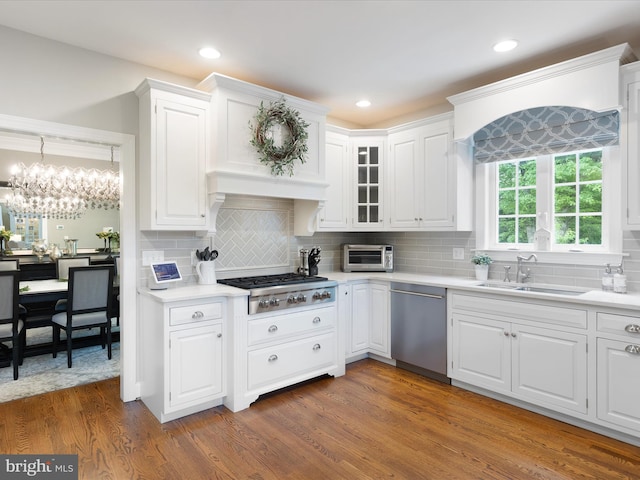 130 Waterfall Ln, Landenberg, PA 19350 - kitchen featuring stainless steel appliances, a sink, light countertops, white cabinetry, and backsplash