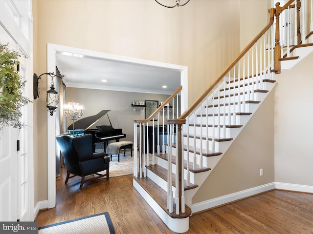 130 Waterfall Ln, Landenberg, PA 19350 - stairs with wood finished floors, ornamental molding, baseboards, and a chandelier
