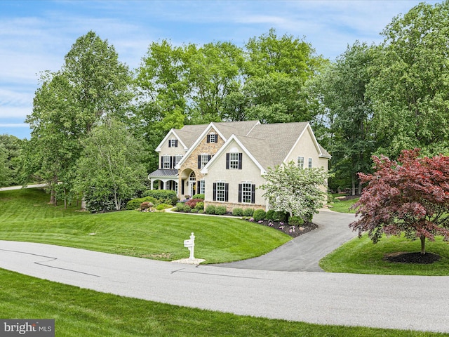 130 Waterfall Ln, Landenberg, PA 19350 - shingle-style home featuring a front yard, stone siding, and stucco siding