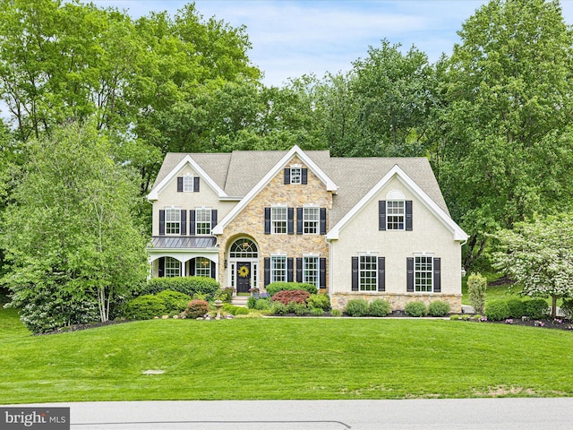 130 Waterfall Ln, Landenberg, PA 19350 - view of front of house featuring stone siding, a front lawn, and stucco siding