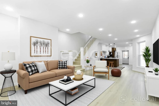 living area featuring light wood-style flooring, stairway, recessed lighting, and baseboards