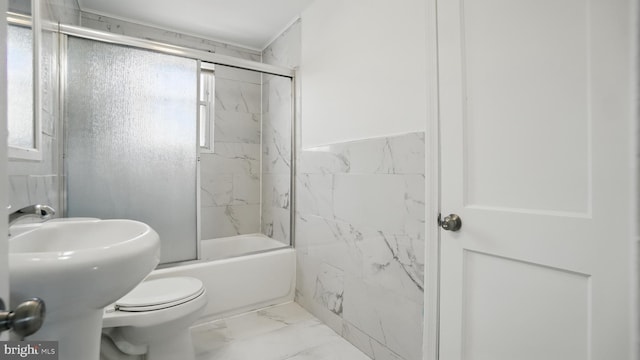 8014 Ritchie Hwy, Pasadena, MD 21122 - bathroom with marble finish floors, tile walls, bath / shower combo with glass door, toilet, and a sink