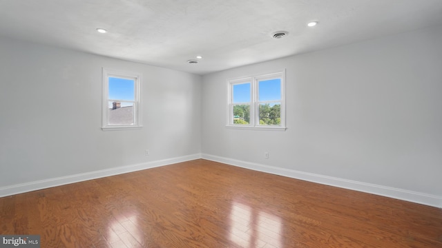 8014 Ritchie Hwy, Pasadena, MD 21122 - unfurnished room featuring baseboards, wood finished floors, healthy amount of natural light, and recessed lighting