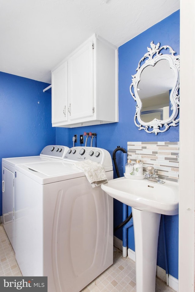 408 Frederick St, Hanover, PA 17331 - washroom featuring cabinet space, washer and clothes dryer, and baseboards