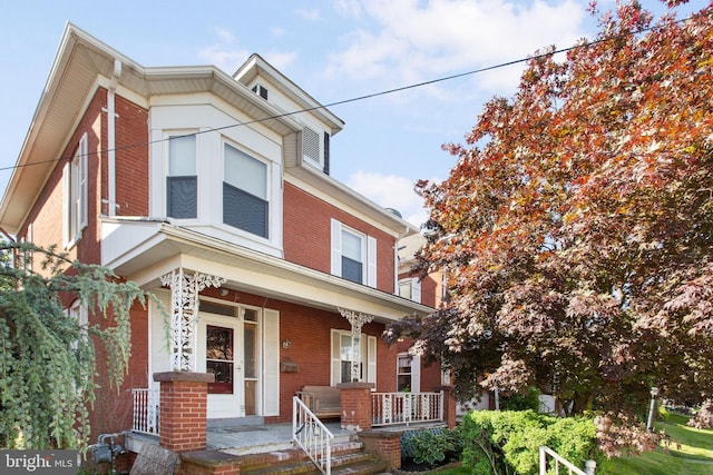 408 Frederick St, Hanover, PA 17331 - view of front of home featuring brick siding and covered porch