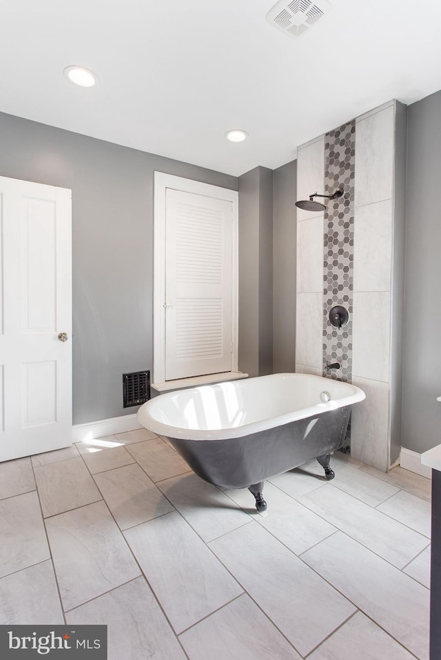 408 Frederick St, Hanover, PA 17331 - full bathroom featuring a freestanding bath, recessed lighting, tiled shower, and baseboards