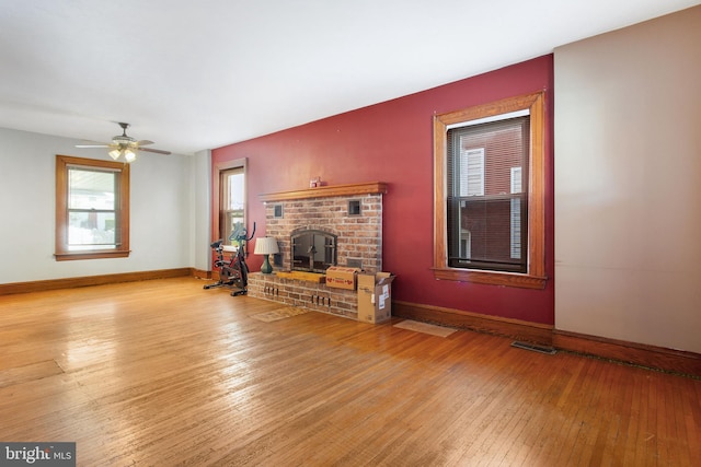 408 Frederick St, Hanover, PA 17331 - living room featuring hardwood / wood-style floors, baseboards, a brick fireplace, and a ceiling fan