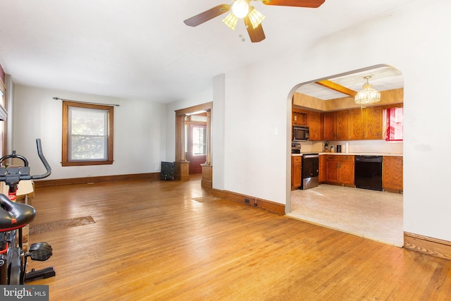 408 Frederick St, Hanover, PA 17331 - unfurnished living room with arched walkways, light wood finished floors, a ceiling fan, and baseboards
