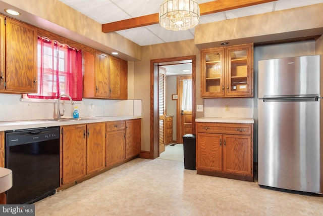408 Frederick St, Hanover, PA 17331 - kitchen with freestanding refrigerator, black dishwasher, light flooring, brown cabinets, and beam ceiling