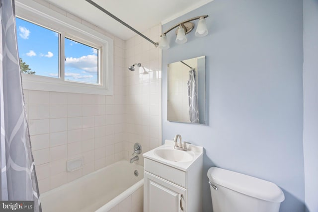 full bath with shower / bathtub combination with curtain, vanity, and toilet