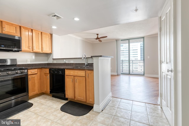 414 Water St Unit 1704, Baltimore, MD 21202 - kitchen featuring appliances with stainless steel finishes, a sink, a peninsula, ceiling fan, and light tile patterned flooring