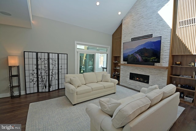 7012 Silverwood St, Philadelphia, PA 19128 - living area with high vaulted ceiling, a fireplace, wood finished floors, recessed lighting, and baseboards