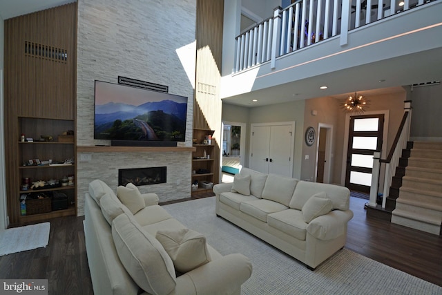 7012 Silverwood St, Philadelphia, PA 19128 - living area with a towering ceiling, wood finished floors, a fireplace, and stairway