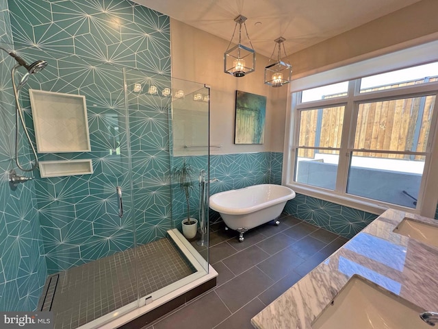 7012 Silverwood St, Philadelphia, PA 19128 - full bathroom with tile walls, a tile shower, tile patterned floors, a freestanding bath, and vanity