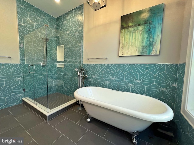 7012 Silverwood St, Philadelphia, PA 19128 - bathroom with tile walls, a stall shower, a soaking tub, tile patterned floors, and wainscoting