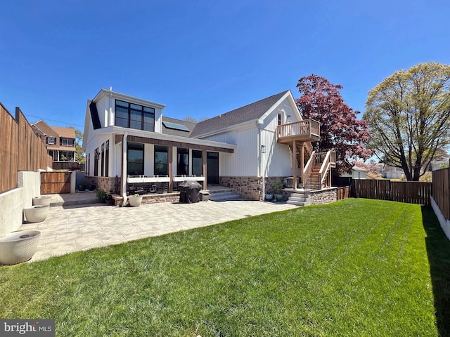 7012 Silverwood St, Philadelphia, PA 19128 - back of house with stairs, a patio, brick siding, and solar panels