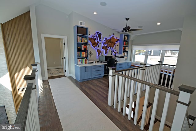7012 Silverwood St, Philadelphia, PA 19128 - hallway with dark wood finished floors, a desk, vaulted ceiling, an upstairs landing, and baseboards