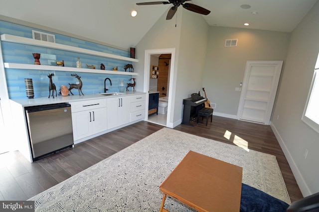 7012 Silverwood St, Philadelphia, PA 19128 - indoor wet bar featuring dishwasher, dark wood-style floors, a ceiling fan, baseboards, and recessed lighting