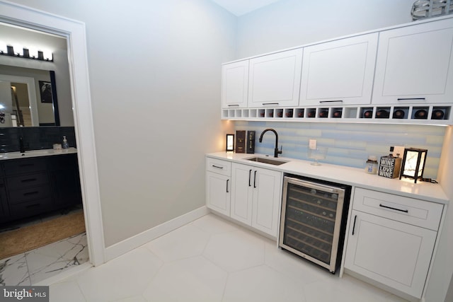 7012 Silverwood St, Philadelphia, PA 19128 - indoor wet bar featuring beverage cooler and baseboards
