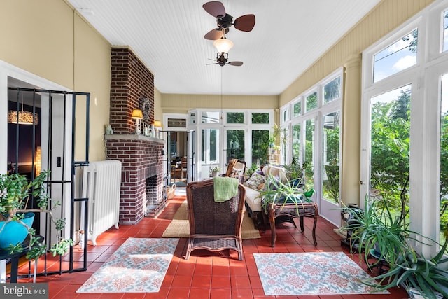 sunroom / solarium with tile patterned floors