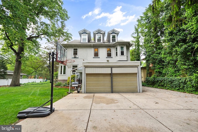 view of front of property featuring stucco siding, a garage, and driveway