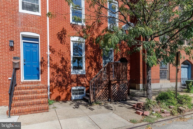 110 W Hamburg St, Baltimore, MD 21230 - property entrance with brick siding and fence