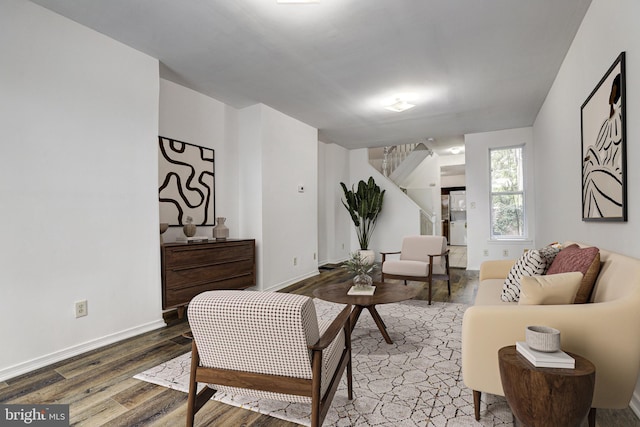 110 W Hamburg St, Baltimore, MD 21230 - living area with stairs, wood finished floors, and baseboards