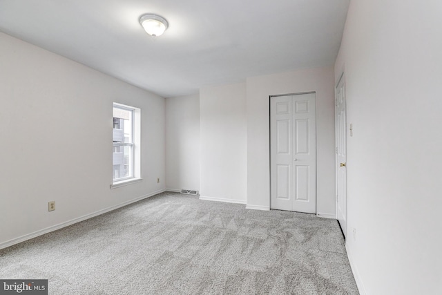 110 W Hamburg St, Baltimore, MD 21230 - unfurnished bedroom with carpet floors, baseboards, and a closet