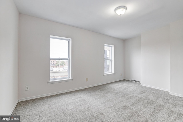 110 W Hamburg St, Baltimore, MD 21230 - empty room with plenty of natural light, carpet flooring, and baseboards