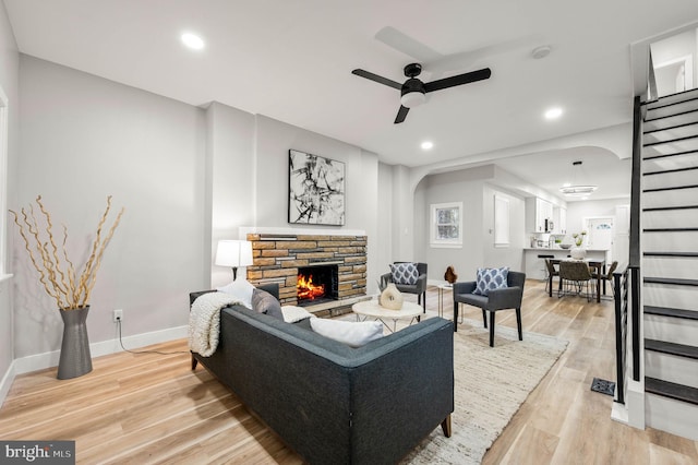 5113 W Thompson St, Philadelphia, PA 19131 - living room featuring arched walkways, ceiling fan, a fireplace, light wood-type flooring, and recessed lighting