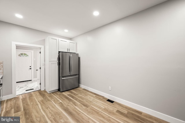 5113 W Thompson St, Philadelphia, PA 19131 - kitchen featuring freestanding refrigerator, baseboards, light wood-type flooring, white cabinetry, and recessed lighting