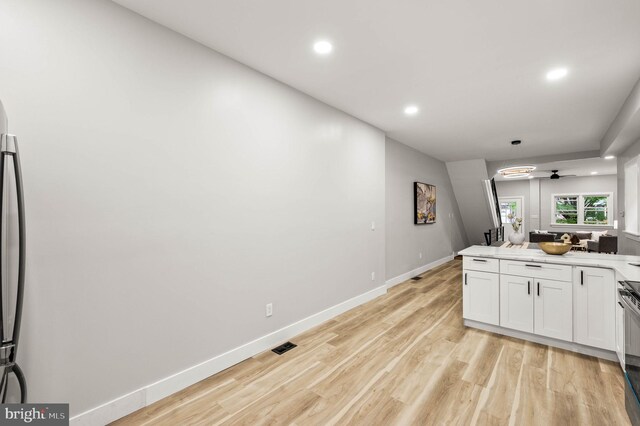 5113 W Thompson St, Philadelphia, PA 19131 - kitchen with a ceiling fan, baseboards, white cabinetry, electric stove, and recessed lighting