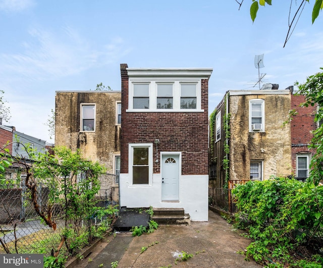 5113 W Thompson St, Philadelphia, PA 19131 - view of front of house with fence, brick siding, and stucco siding