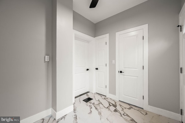 5113 W Thompson St, Philadelphia, PA 19131 - foyer entrance with light marble finish flooring, baseboards, and ceiling fan