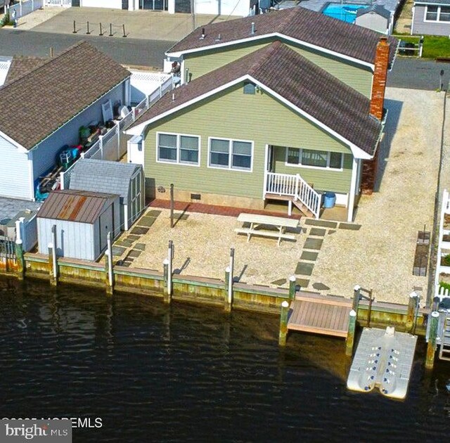 965 Seagull Dr, Lanoka Harbor, NJ 08734 - back of property featuring a water view and a chimney