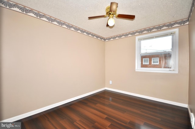 8922 Brous Ave, Philadelphia, PA 19152 - spare room featuring baseboards, dark wood finished floors, a ceiling fan, and a textured ceiling