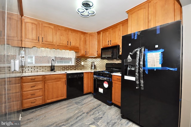 8922 Brous Ave, Philadelphia, PA 19152 - kitchen with black appliances, a sink, light countertops, and tasteful backsplash