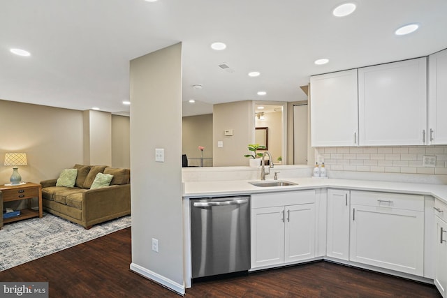kitchen with dishwasher, a sink, dark wood-type flooring, white cabinetry, and recessed lighting