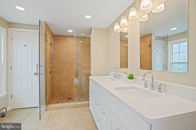 full bath featuring a shower stall, recessed lighting, tile patterned flooring, and double vanity