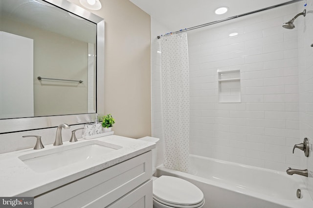 full bath featuring shower / bath combo with shower curtain, toilet, and vanity