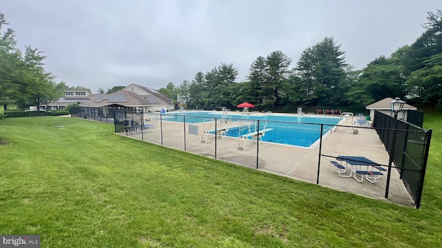 community pool with a patio area