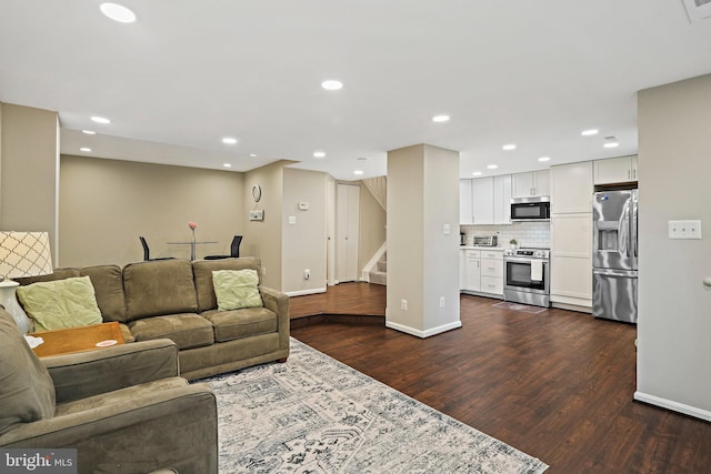 living area with stairway, dark wood-style floors, baseboards, and recessed lighting